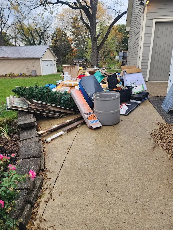 Dumpster being loaded with debris for Demolition Dumpster Rental in Highland Heights